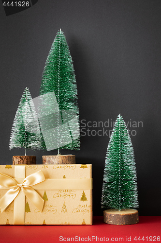 Image of Christmas decoration green fir trees figure on red ground