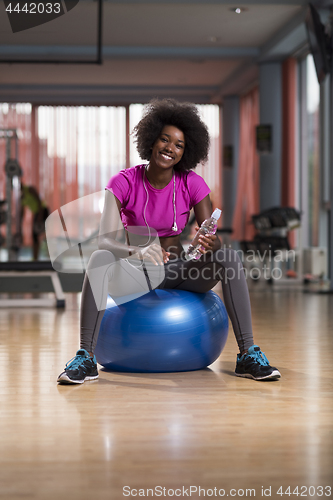 Image of woman  relaxing after pilates workout