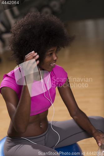 Image of woman  relaxing after pilates workout