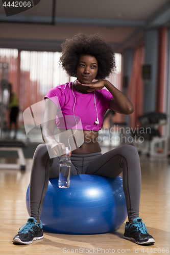 Image of woman  relaxing after pilates workout