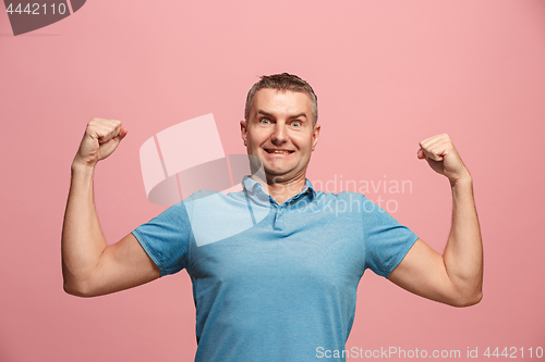 Image of Winning success man happy ecstatic celebrating being a winner. Dynamic energetic image of male model