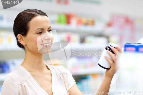 Image of female customer choosing drugs at pharmacy