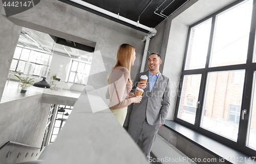 Image of businesswoman and businessman at coffee break