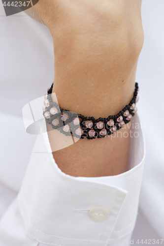 Image of Stylish black bead bracelet on female hand