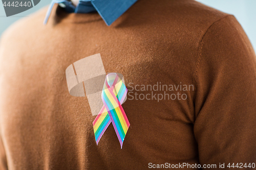 Image of man with gay pride rainbow awareness ribbon