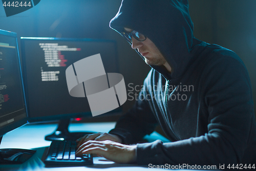 Image of hacker using computer virus for cyber attack