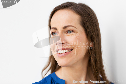 Image of face of happy smiling middle aged woman