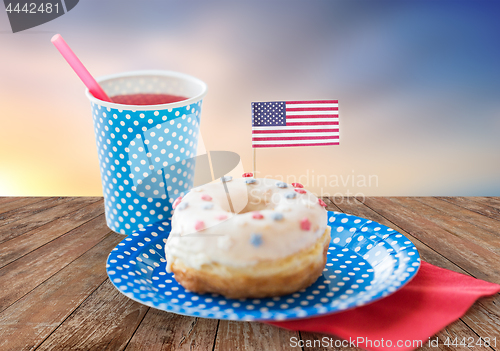 Image of donut with american flag decoration and drink