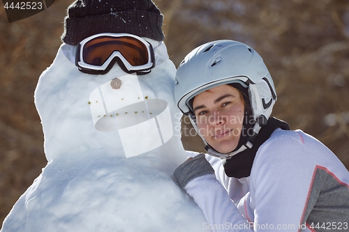 Image of Building a snowman in a ski trip