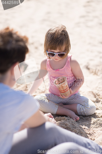 Image of Mom and daughter on the beach