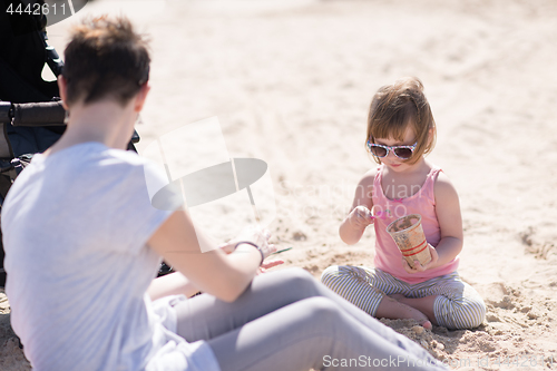 Image of Mom and daughter on the beach