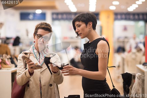 Image of best friend shopping in big mall