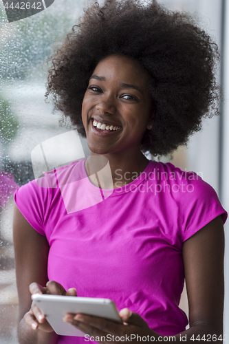 Image of african american woman using tablet