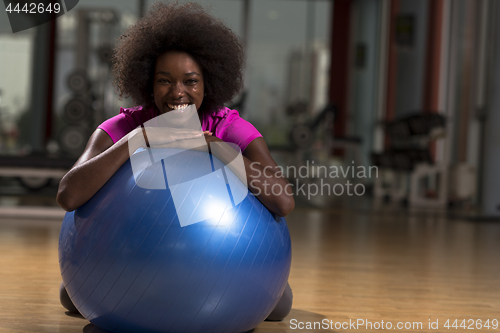 Image of woman  relaxing after pilates workout