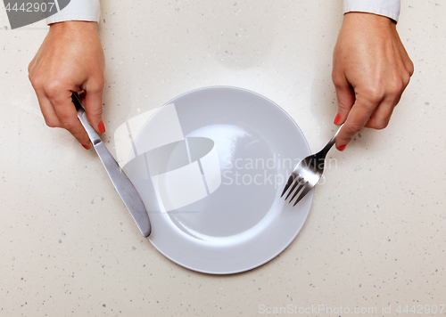 Image of visitor which holds knife and fork
