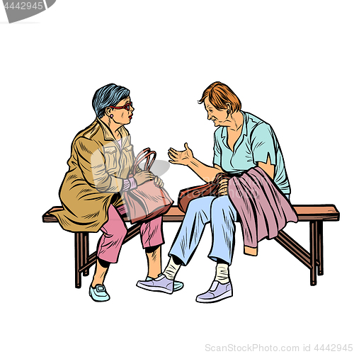 Image of two elderly women sitting on a bench