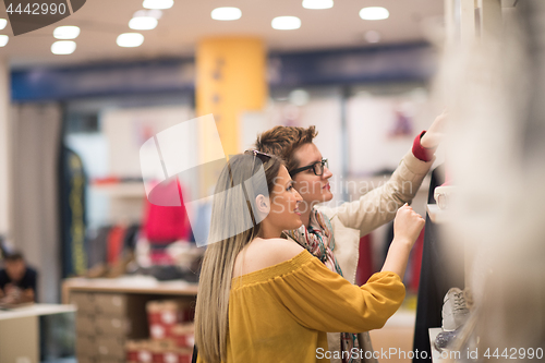 Image of best friend shopping in big mall