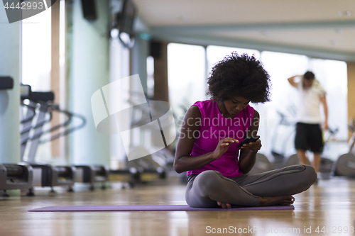 Image of african american woman exercise yoga in gym