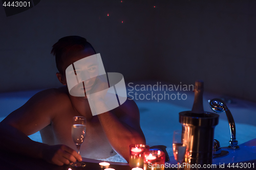 Image of man relaxing in the jacuzzi