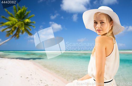 Image of beautiful woman enjoying summer over beach