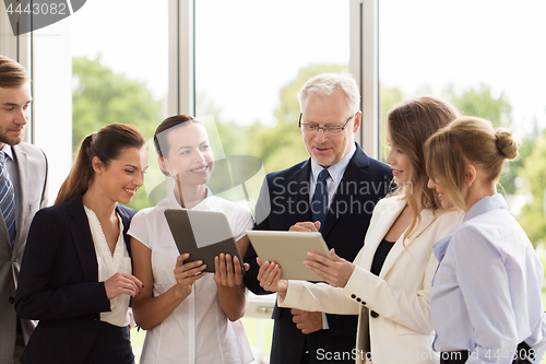 Image of business people with tablet pc computers at office