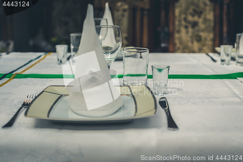 Image of Served table with plate, rustic toned