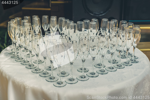 Image of Table with champagne glasses, rustic toned