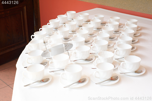 Image of Group of white coffee cups in cafe bar