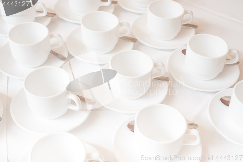 Image of Group of white coffee cups in cafe bar