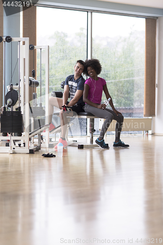 Image of couple in a gym have break