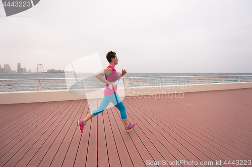 Image of woman running on the promenade