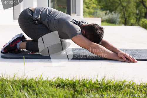 Image of man doing morning yoga exercises
