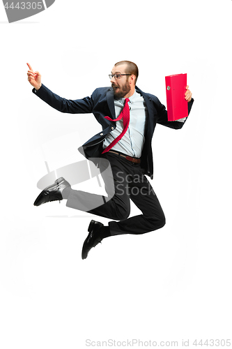 Image of Funny cheerful businessman jumping in air over white background