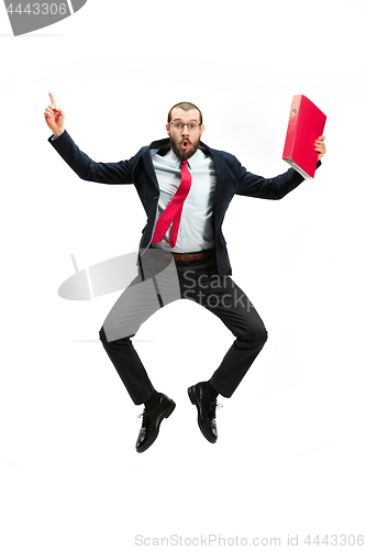 Image of Funny cheerful businessman jumping in air over white background