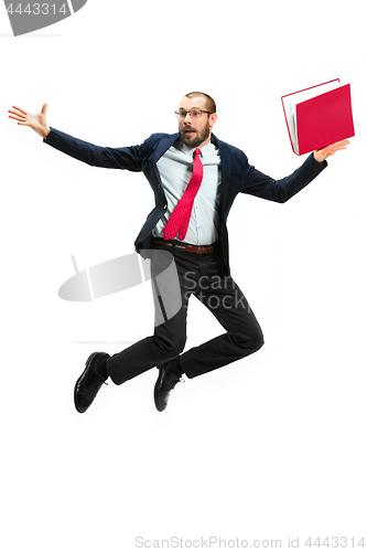 Image of Funny cheerful businessman jumping in air over white background