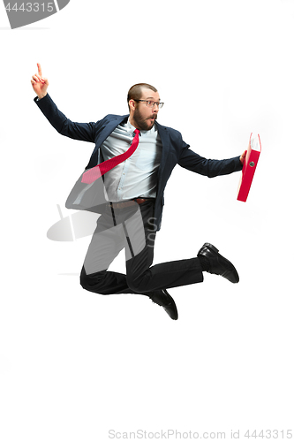 Image of Funny cheerful businessman jumping in air over white background