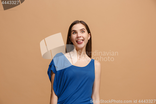 Image of The woman with weird expression isolated on pastel