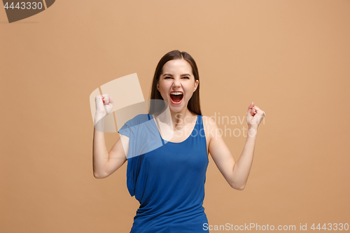 Image of Winning success woman happy ecstatic celebrating being a winner. Dynamic energetic image of female model