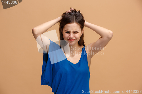 Image of Beautiful woman in stress isolated on pastel