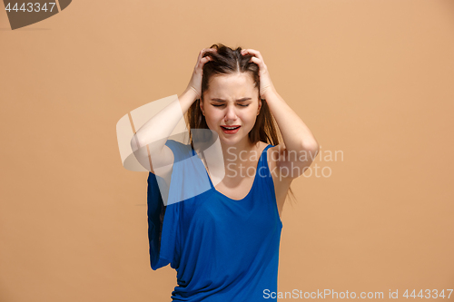 Image of Beautiful woman in stress isolated on pastel