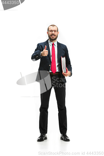 Image of Full body portrait of businessman with folder on white