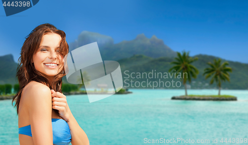 Image of happy woman in bikini swimsuit on bora bora beach