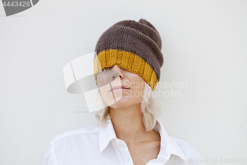 Image of Beautiful woman in warm brown beanie hat.