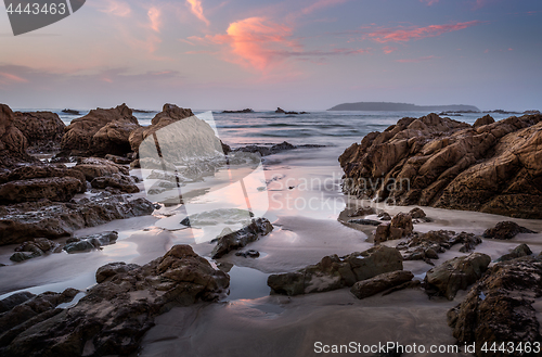 Image of Coastal rocks and reflections in dawn hours