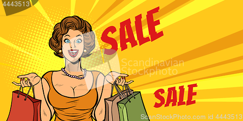 Image of joyful woman shopping on sale