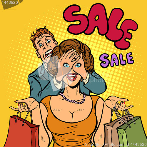 Image of husband and wife on sale shopping