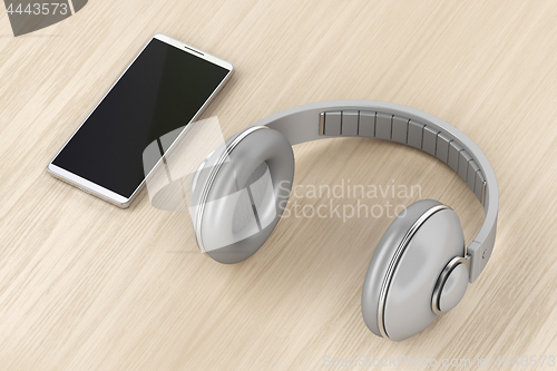 Image of Over-ear headphones and smartphone