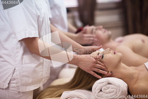 Image of couple enjoying head massage at the spa