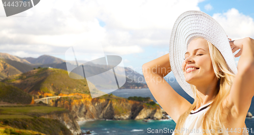 Image of woman over bixby creek bridge on big sur coast