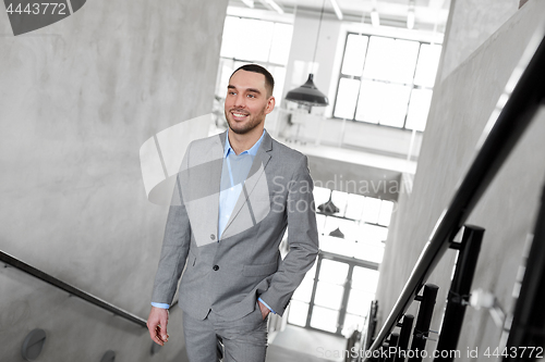 Image of businessman walking upstairs